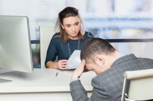 Human resources consultant talking with depressed employee